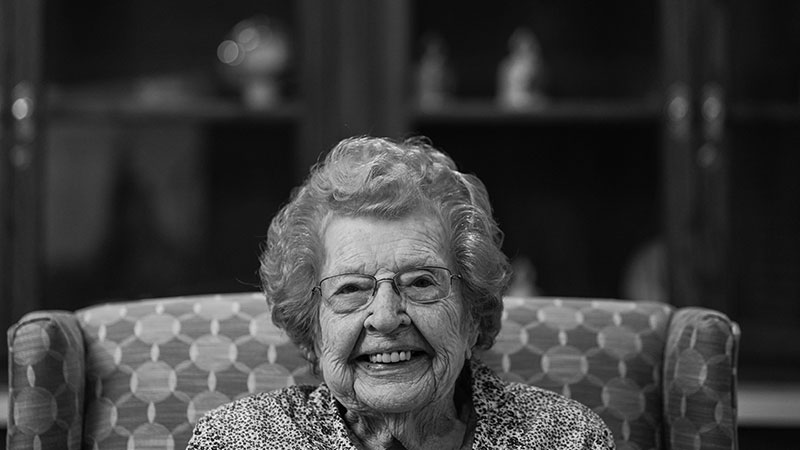Elderly woman sitting on a chair